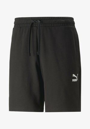 Čierne športové šortky vyrobené z ľahkého materiálu, s elastickým pásom na šnúrku a malým bielym logom na ľavej nohe.