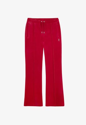 Pantalon en velours rouge avec une coupe décontractée, une taille élastique avec cordon de serrage, deux poches latérales et des détails de couture verticales. Présente un accent de logo.
