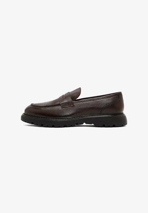 Brown leather loafer with textured finish, rounded toe, and rubber sole featuring a patterned tread. Simple design with no visible hardware.