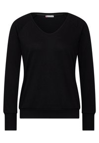 Top nero a maniche lunghe con scollo a V, realizzato in morbido misto cotone. Presenta polsini e fondo a coste, con maniche raglan per una vestibilità rilassata.