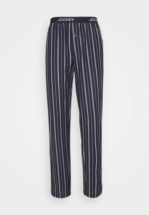 Katoenen pyjamabroek in marineblauw met witte verticale strepen. Heeft een zachte, elastische tailleband met logo en een knoopsluiting.