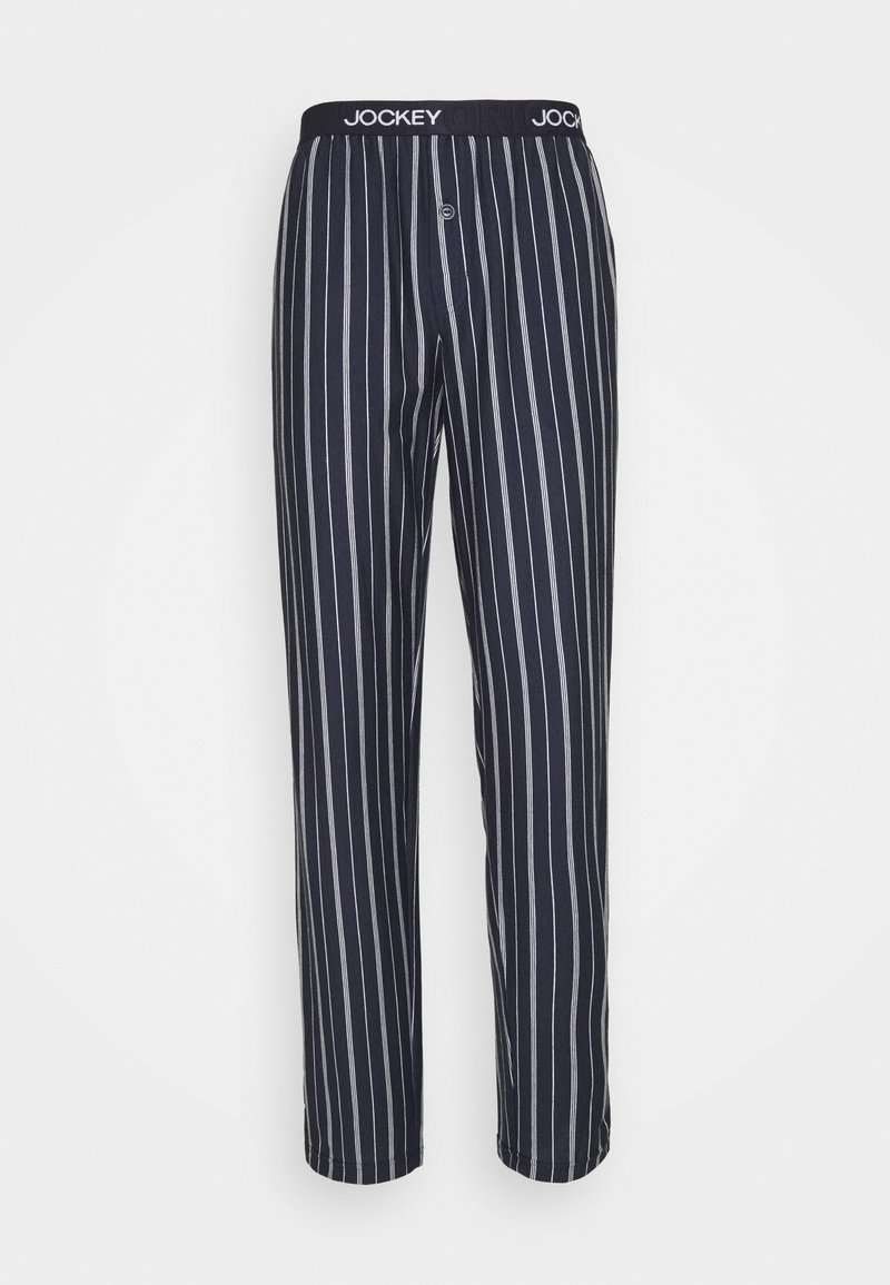Pajamas i bomull i marinblått med vita vertikala ränder. Har en mjuk, elastisk midja med logo och en knappgylf.