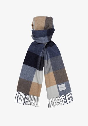 Wool scarf featuring a large plaid pattern in navy, grey, beige, and cream, with fringe edges and a branded tag.