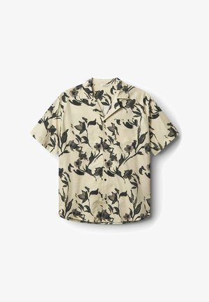 Srajca s kratkimi rokavi v svetlo bež barvi z temnim cvetličnim vzorcem, z žepom na prsih in sproščenim krojem.