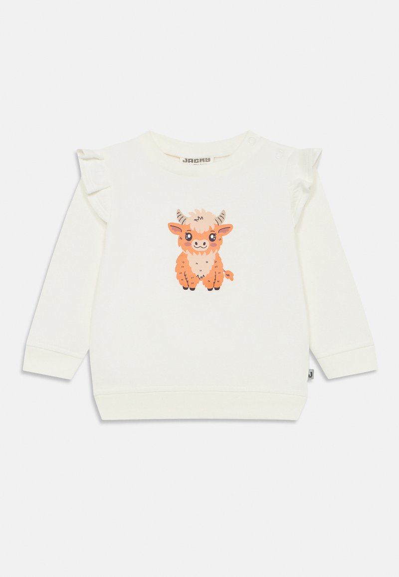 Sweatshirt creme com mangas longas, apresentando detalhes em babados nos ombros e uma ilustração de uma vaca de desenho animado em laranja e castanho na parte da frente.