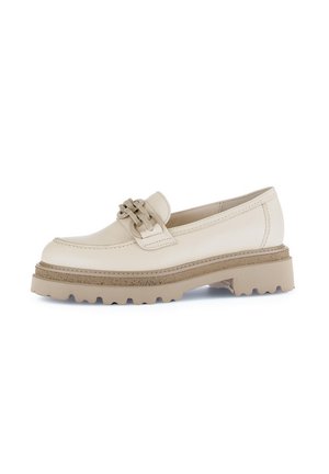 Beige leather loafer with a textured cream band and decorative hardware. Chunky beige sole with a rugged tread design for traction.
