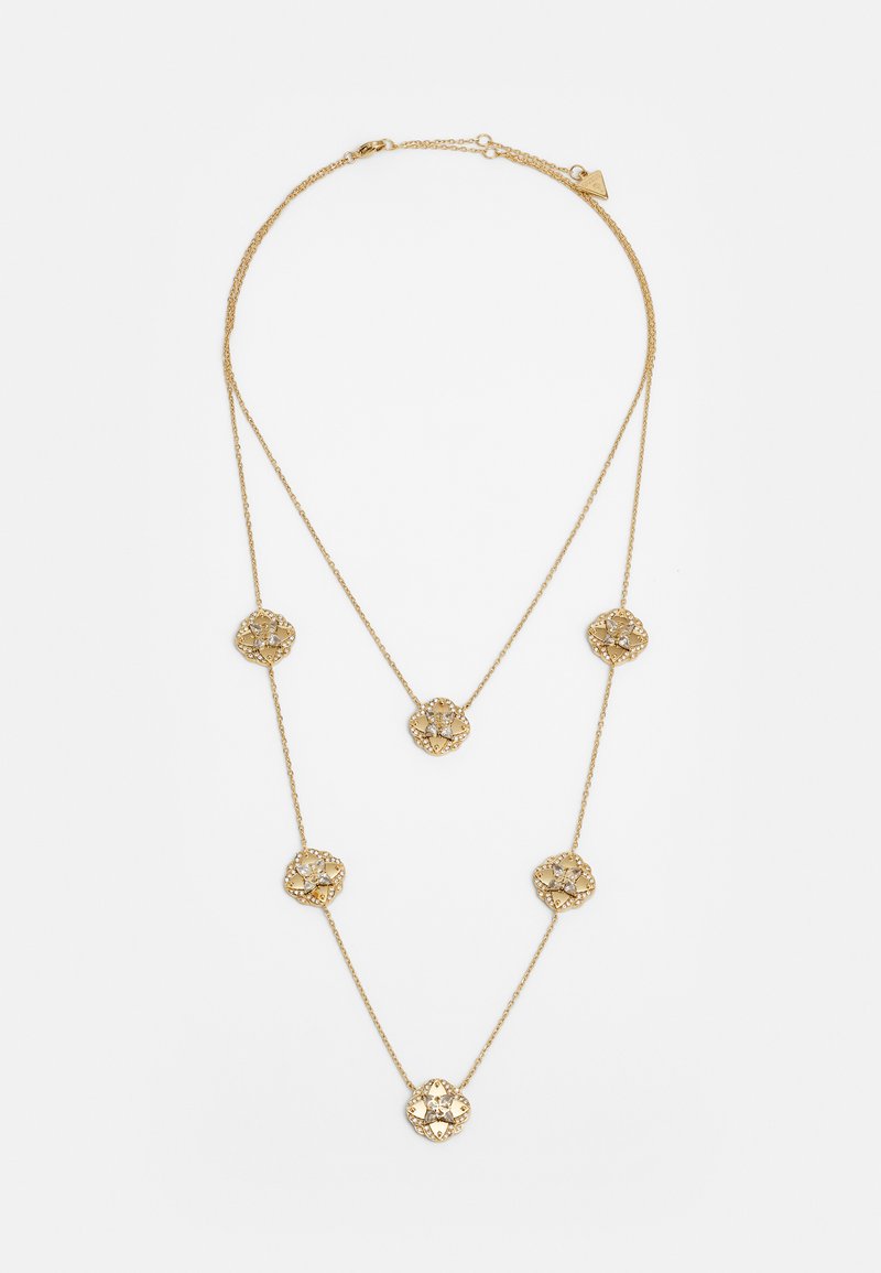Collier en couches de couleur dorée avec des pendentifs en forme de fleurs intricats ornés, une chaîne délicate et une longueur ajustable.