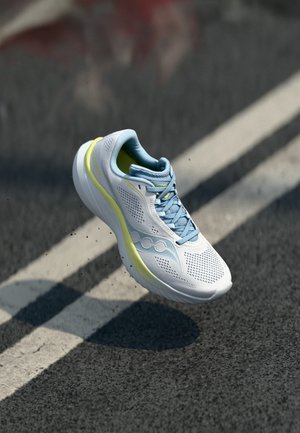 Lightweight running shoe in white mesh with a blue and yellow accent, featuring a cushioned sole and ventilated design for breathability.