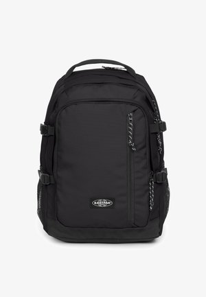 Sort stofrygsæk med polstret ryg, justerbare stropper, flere lynlåslommer og meshlommer på siderne. Eastpak-logo til stede.