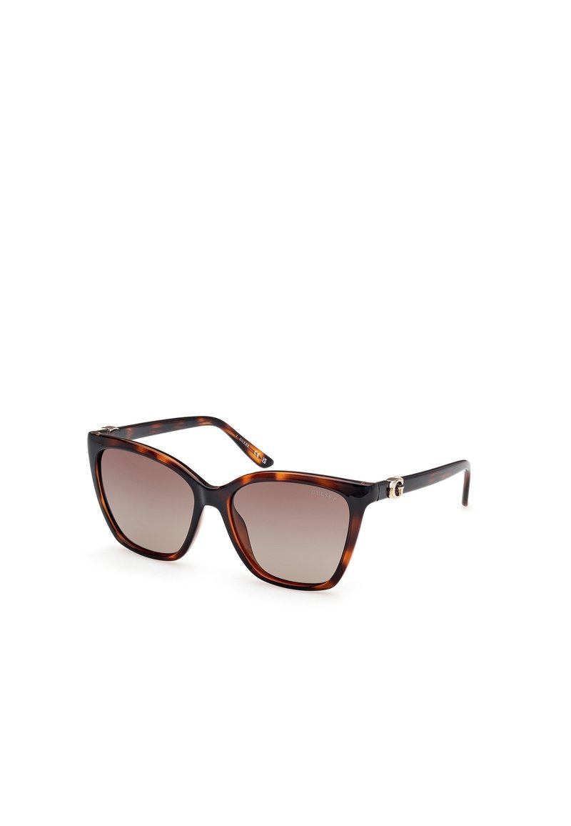 Ochelari de soare cu model țestoasă, în formă de ochi de pisică, cu lentile gradient, detalii din metal de culoare aurie pe brațe, finisaj lucios și ramă groasă.