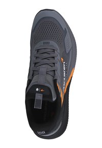 Gray athletic shoe with mesh upper, orange accents, and textured sole. Features padded tongue and lace-up design. Logo on side and heel.
