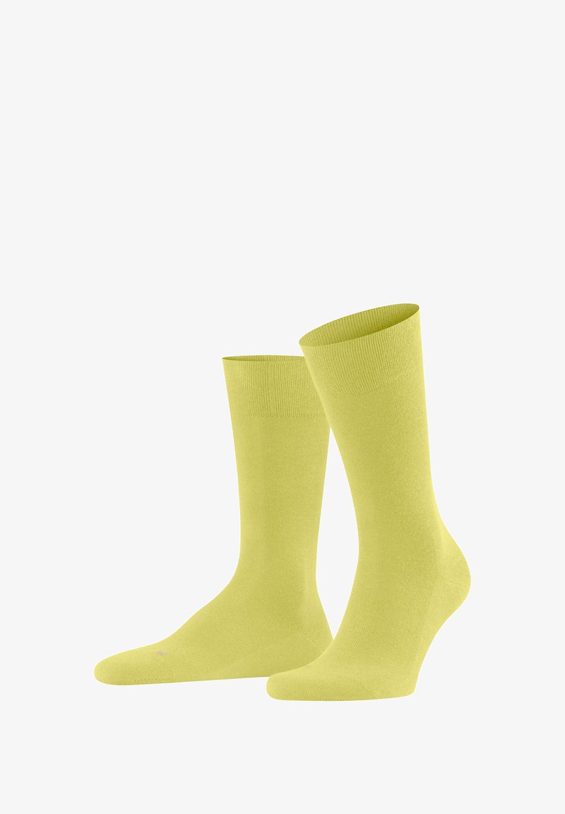 Gelbe Baumwollsocken mit einem gerippten Bündchen, mittlerer Höhe, glatter Textur und ohne sichtbare Muster oder Verzierungen.