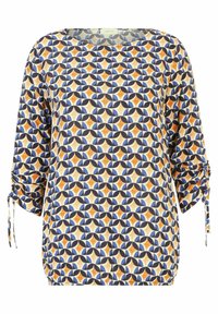 Blusa ampia con scollo rotondo. Presenta un motivo geometrico in blu, arancione e crema. Maniche elastiche con dettagli a fiocco.