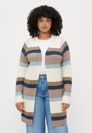 Stripet cardigan i beige, marineblå, lyseblå og kremfarge. Strikket stoff med åpen front, ribbet tekstur og lange ermer.