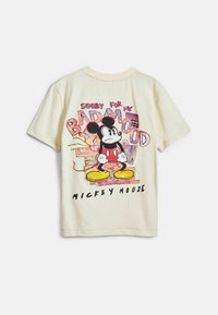 Krem majica od pamuka s grafikom Mickey Mousea i natpisom "Žao mi je zbog mog lošeg raspoloženja" u podebljanim šarenim slovima.