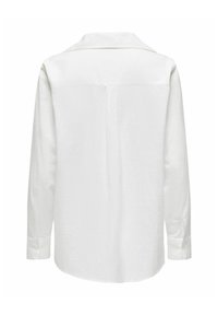 White long-sleeve shirt made of textured fabric, featuring a straight cut, a back yoke detail, and buttoned cuffs.