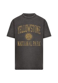 Dark gray vintage-style T-shirt with yellow "Yellowstone National Park" text and circular emblem featuring a tree and mountain.