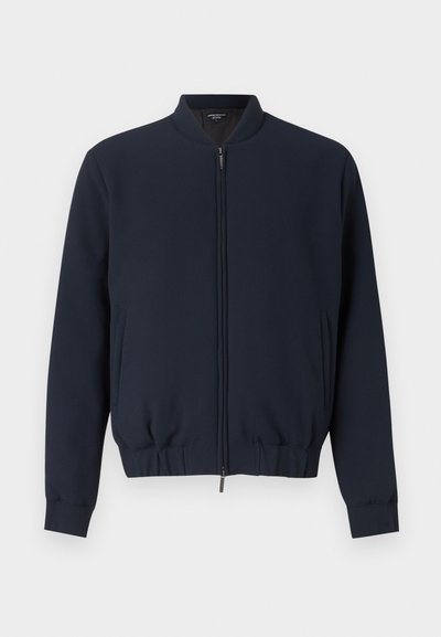 Μπουφάν μπλέ ναυτικό με φερμουάρ, με ριμπ γιακά, μανσέτες και τελείωμα, διαθέτει πλαϊνές τσέπες και ύφασμα με λεία υφή.