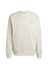 Beige mikina s kulatým výstřihem a žebrovanými manžetami a spodním lemem, která má na levé hrudi malé logo Adidas.