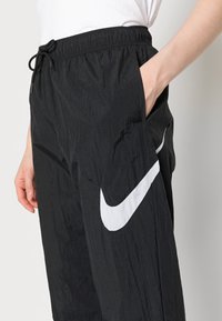 Nike Sportswear PANT - Tracksuit bottoms - black
