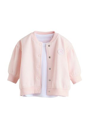Pink cotton blend bomber jacket with snap buttons, ribbed cuffs, and hem. Features a white T-shirt underneath and a round logo badge.