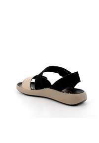 Infradito a righe con tomaia nera e beige, spalline morbide e testurizzate, e suola beige flessibile con tacco basso.