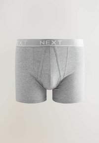 Boxers en coton gris avec une ceinture élastique douce portant le mot "NEXT" en texte gris clair. Design classique avec une texture lisse.
