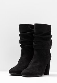 Unisa Stivaletti - black