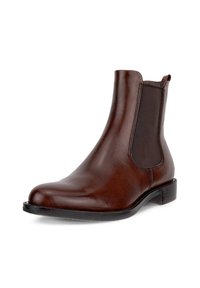 Brown leather Chelsea boot with elastic side panel, pull tab at heel, low stacked heel, and rounded toe on white background.