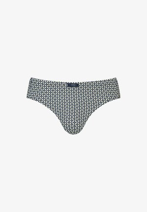 Sous-vêtement masculin de type slip avec un motif géométrique bleu marine et blanc, et une petite étiquette de marque noire au centre de la ceinture avant.