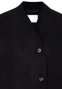 Black wool coat featuring a mandarin collar, front button closure with two black buttons, and a smooth texture. Label visible inside.