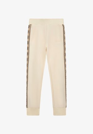 Cremefarbene Sweatpants mit elastischem Bund, ausgestattet mit schwarzen Logo-Streifen an den Seiten und gerippten Bündchen. Hergestellt aus weichem, glattem Stoff.