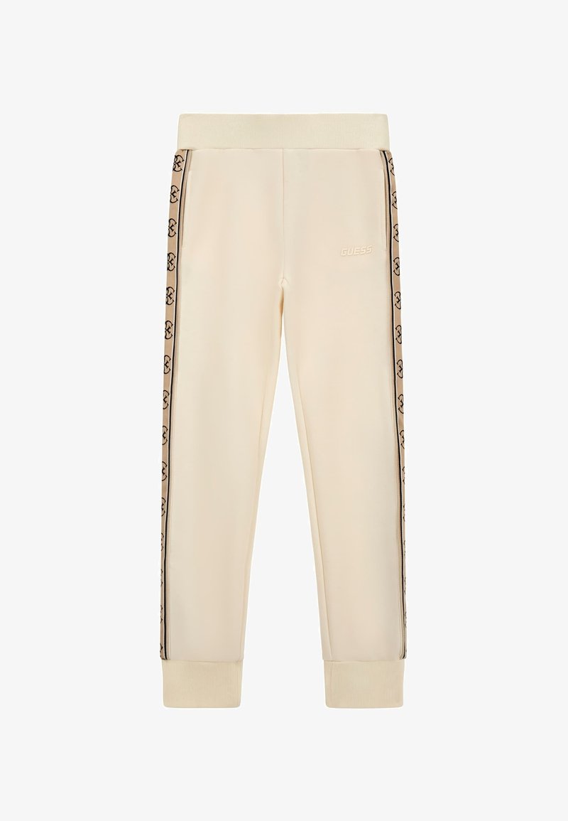Kremne hlače s kapuco in elastičnim pasom, ki imajo črne logotipne črte na straneh in rebraste manšete. Narejene so iz mehkega, gladkega materiala.