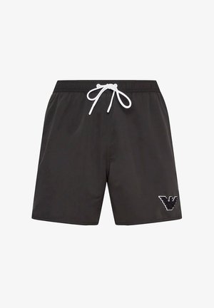 Bañador negro hecho de material sintético con una cinturilla elástica y cordón blanco. Presenta un logo blanco en la parte inferior izquierda.