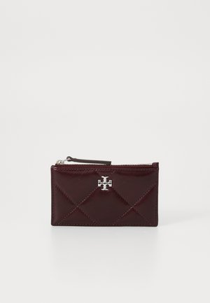 Burgundy leather cardholder with a quilted design, silver logo accent, zip closure, and a textured finish. Compact and rectangular shape.