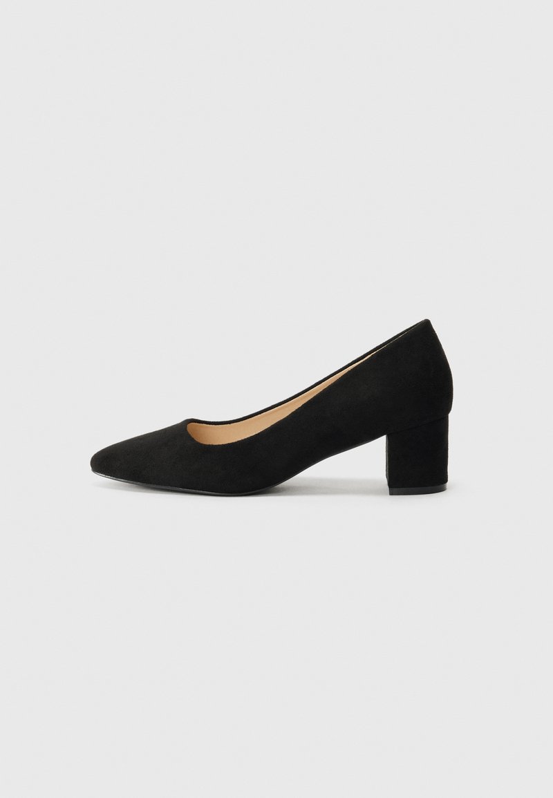Black suede block-heel pump with a pointed toe and an open cut-out on the side, featuring a smooth texture and a solid color design.