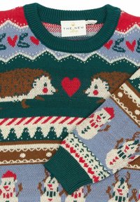Maglione a maglia con colori verde, rosso e blu. Il design include ricci, cuori e pupazzi di neve in un motivo ripetitivo. Maniche a coste.
