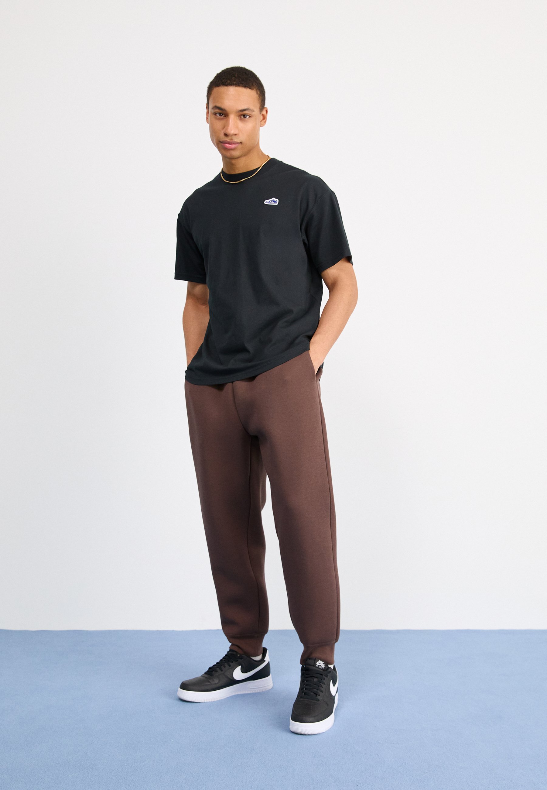 pantalon nike tech marron