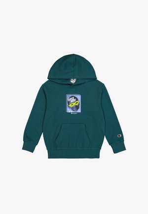 Sudadera con capucha en color verde azulado con bolsillo. Presenta una impresión gráfica de la cara de un superhéroe con gafas amarillas sobre un fondo azul. Logo de Champion en la manga.
