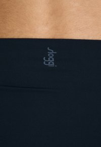 Black Sloggi underwear with a smooth, stretchy fabric featuring a soft waistband. Subtle branding in light gray. Minimalistic design.