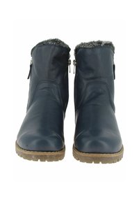 Une paire de bottines en cuir bleu foncé avec des zips sur le côté, un bord en fausse fourrure et des semelles en caoutchouc brun robuste, montrées de face.