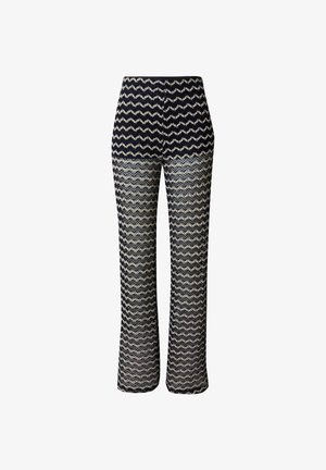 Knit trousers with a zigzag pattern in navy and cream, flared legs, high waistband, textured fabric, and elastic waist for comfort.