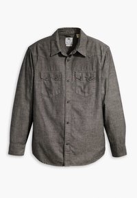 Camicia grigia a maniche lunghe con bottoni, realizzata in tessuto testurizzato. Presenta due tasche sul petto con patta e bottoni a contrasto. Design con colletto classico.