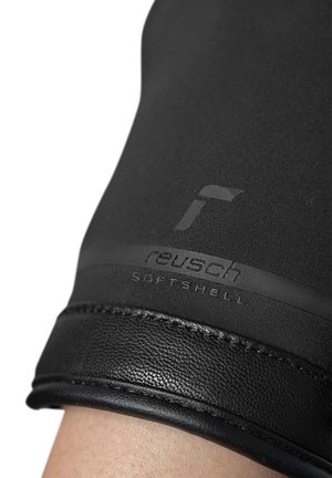 Black softshell glove featuring leather accents. Includes embossed branding "reusch" and "SOFTSHELL" on the wrist area. Textured surfaces visible.
