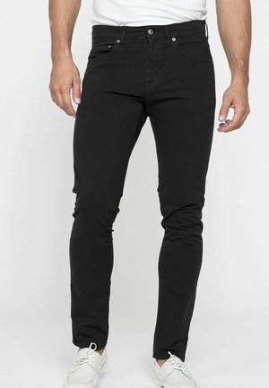 Jeans neri aderenti realizzati in denim liscio, con un classico design a cinque tasche, passanti per cintura e chiusura con zip e bottone.
