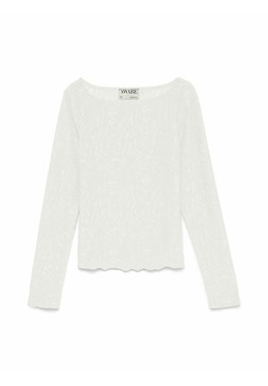 Bela dolgoročna majica z dolgo teksturirano tkanino z nežnim vzorcem zebra, z okroglim izrezom na vratu in robom z valovitim robom, z napisom "AWARE" znotraj ovratnika.