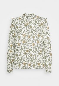 Chemise boutonnée à motifs floraux verts et orange sur fond blanc ; dotée d'épaules à volants et de manches longues avec poignets froncés.