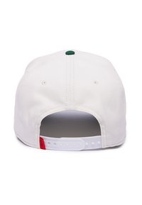 White baseball cap with a plastic adjustable strap, green button on top, and red logo tag on the back. Smooth fabric texture.
