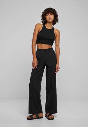 WIDE - Trousers - black