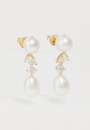 Zlate uhane z okroglimi in kapljičastimi belimi biseri, okrašeni z jasno kristalnimi akcenti in gladko, polirano površino.